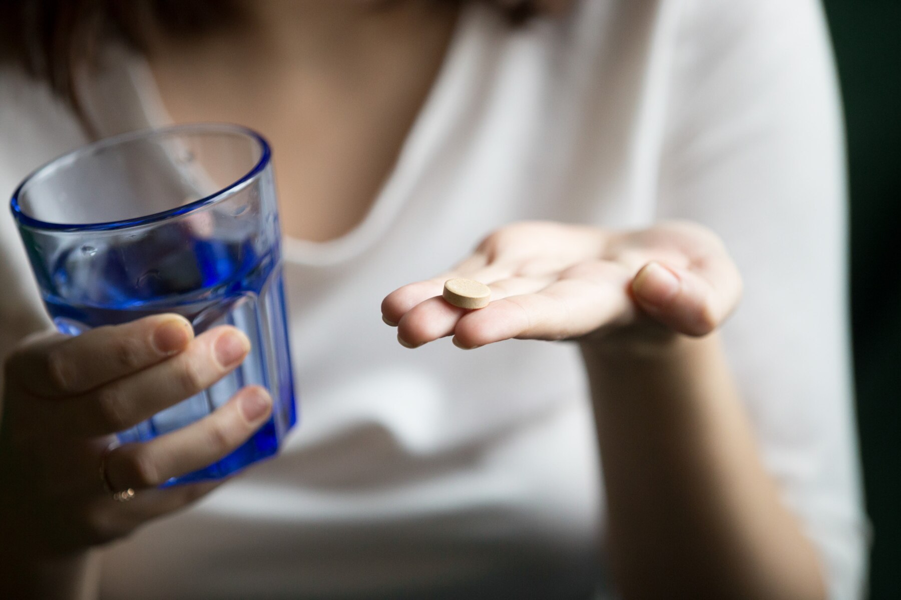 female-hands-holding-pill-glass-water-closeup-view_1163-4878.jpg